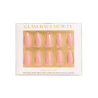 Glam Haus Beauty press-on nails packaging with gold accents on a white background, pink nails color, almond shaped nails 
