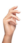 close-up of a hand wearing white nails. nail color white. nail shape short square with a white background